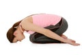 Young woman doing yoga, Balasana-Child`s Pose